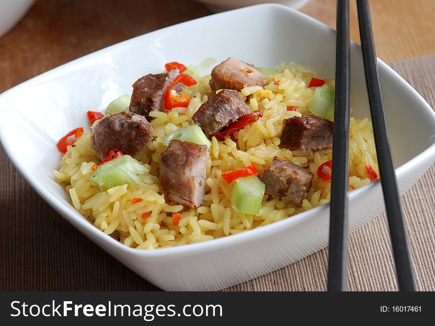 Diced pork with rice in a bowl