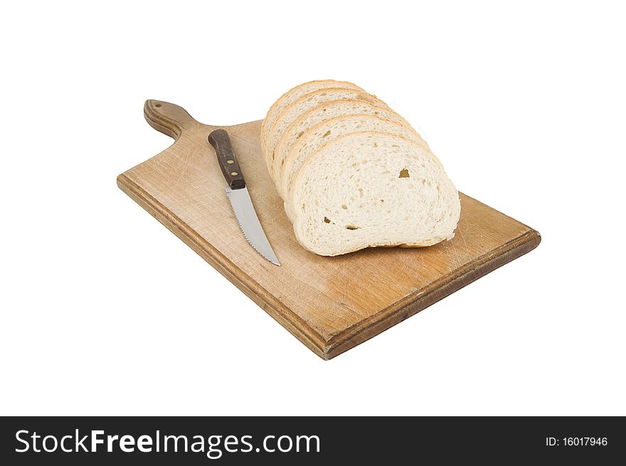 Bread slices with knife on wood cutting board against white background