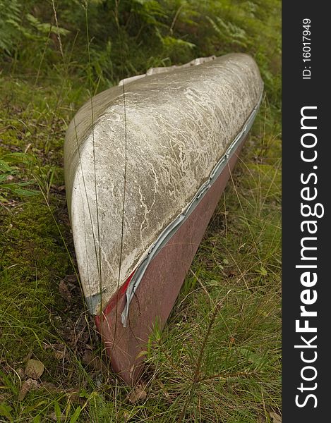 An old abandoned canoe in the forest.