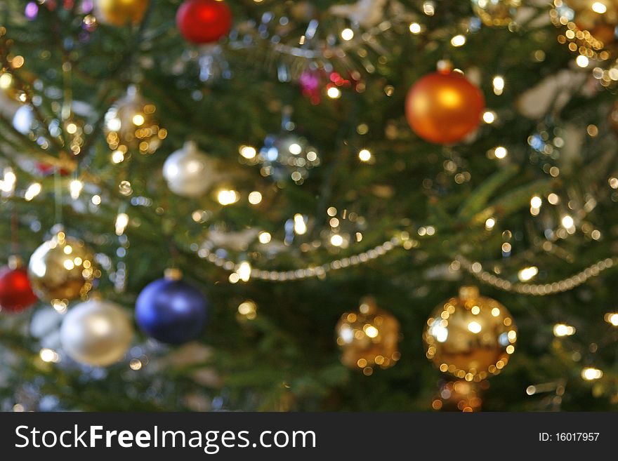 Blurred background from christmas tree with baubles and the lights