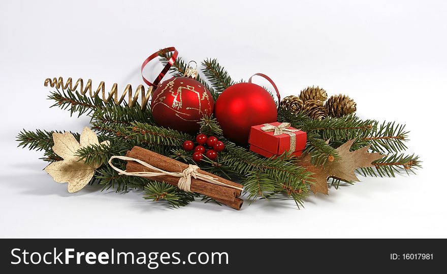 Christmas decoration with the twigs of the spruce and baubles