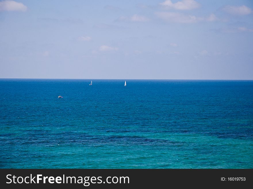 The sea in sunny, clear, windless day. The sea in sunny, clear, windless day.