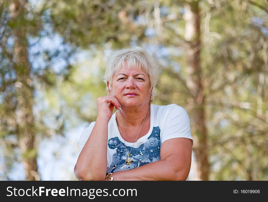 Casual portrait of happy mature woman with  minimal makeup. Casual portrait of happy mature woman with  minimal makeup.