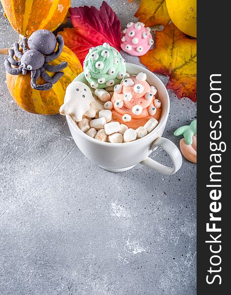 Halloween hot chocolate mugs with funny marshmallows - jack o lantern pumpkins, ghost, monsters, spiders. Halloween hot chocolate mugs with funny marshmallows - jack o lantern pumpkins, ghost, monsters, spiders