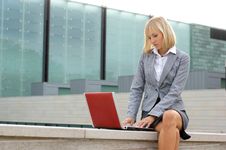 A Young Business Woman Working With A Laptop Royalty Free Stock Photography A Young Business Woman Working With A Laptop Royalty Free Stock Photography