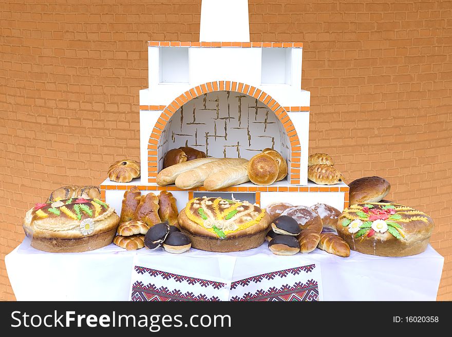 Russian oven with a large quantity of rolls and pies. Russian oven with a large quantity of rolls and pies
