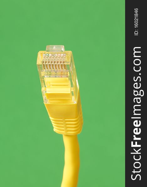 Close up of Ethernet Cable on a green background