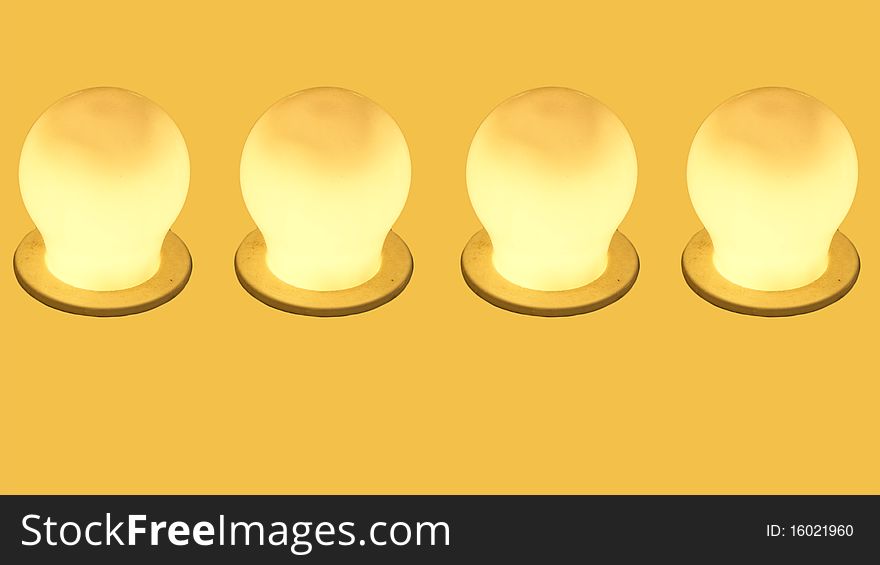 Glowing Yellow Incandescent Light Bulb.