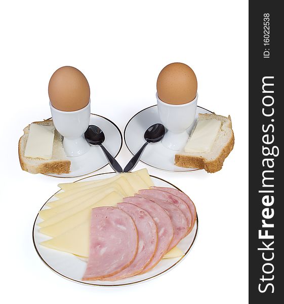 Eggs, cheese and sausage on a white background