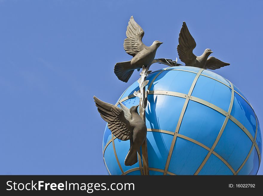 This is a globe with doves on it located in the center of Kiev.