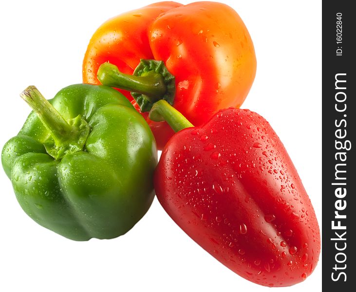 Three peppers isolated red green and orange. Three peppers isolated red green and orange