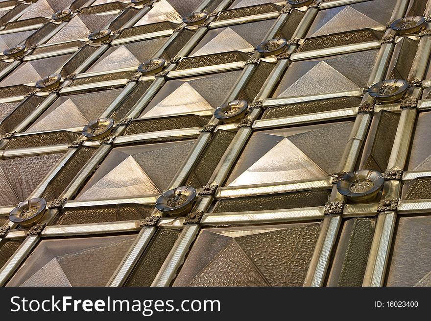 Wall of the bulk glass  tiles different sizes and shapes