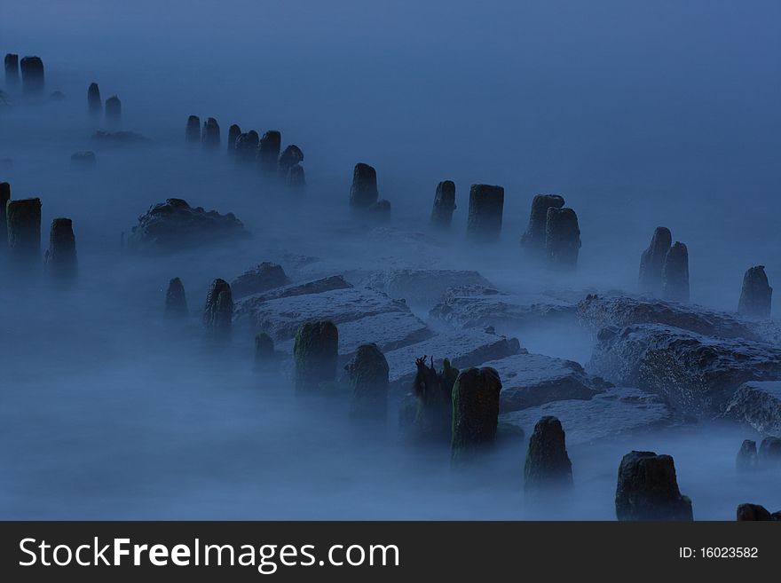 Waves that looks like a fog on a breakwaters. Waves that looks like a fog on a breakwaters.