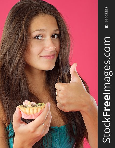 Young women and tasty cream cake on vivid background. Young women and tasty cream cake on vivid background