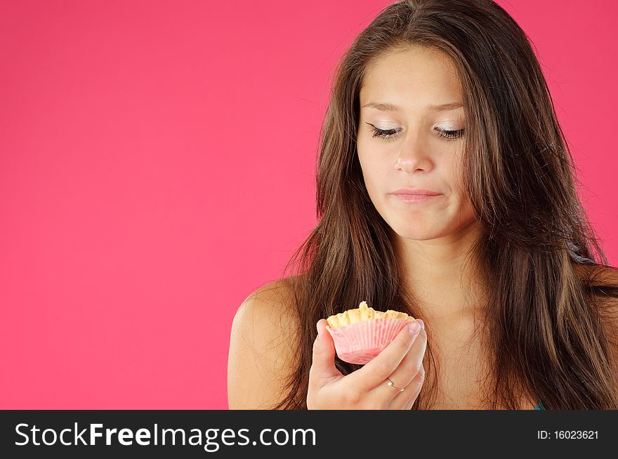 Young women and tasty cream cake on vivid background. Young women and tasty cream cake on vivid background