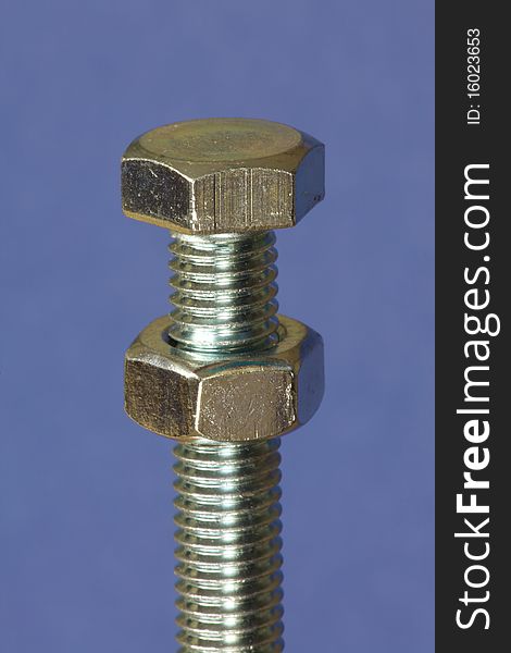 Nut and bolt on a blue background