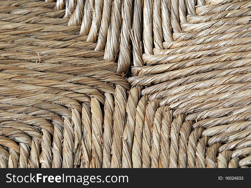 Close up of woven rattan chair seat