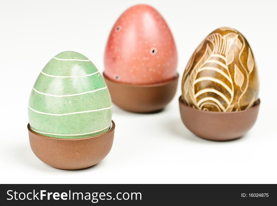 Three stone eggs on a white background