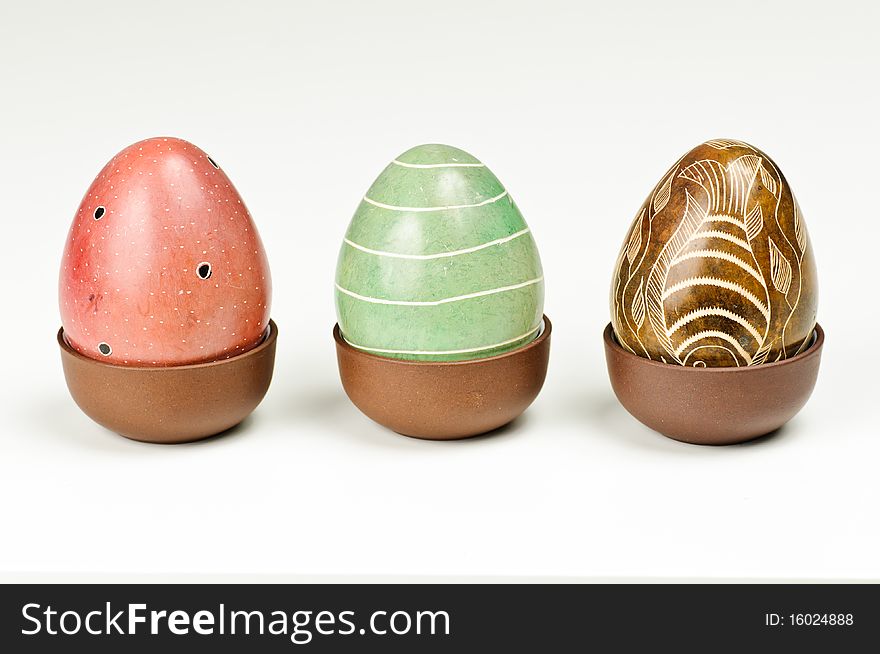 Three stone eggs on a white background