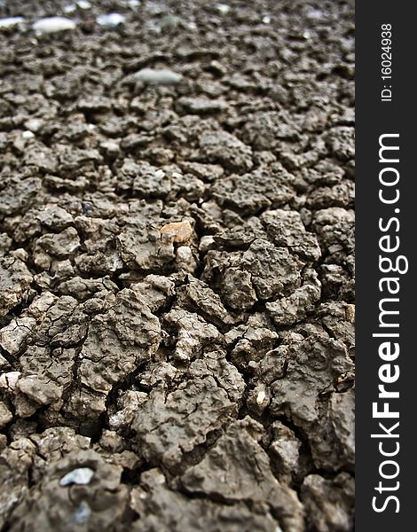 A close up to dry brown soil. A close up to dry brown soil