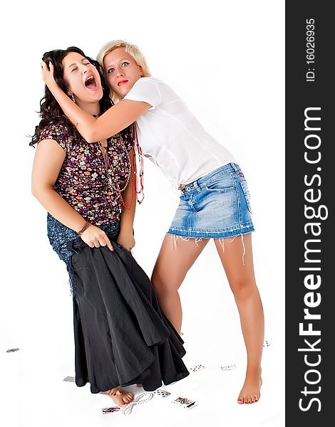 Two women, one embraces another, round a card on a white background