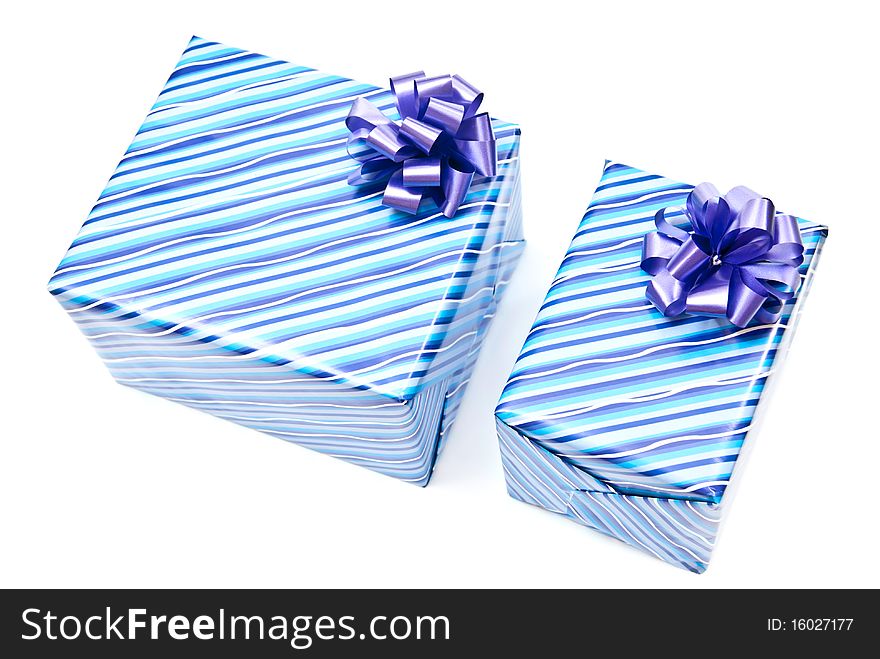 Two blue paper gifts boxes with bows. Isolated on white. Two blue paper gifts boxes with bows. Isolated on white.