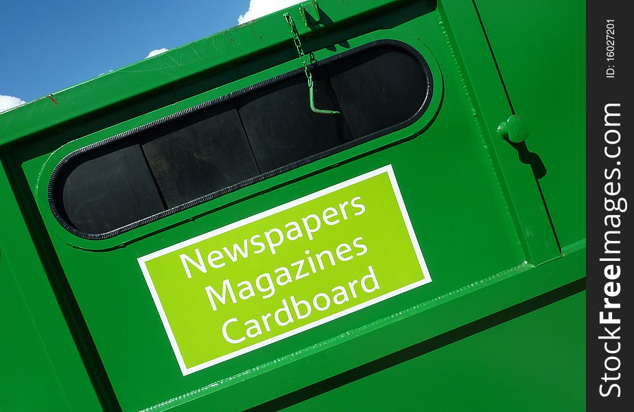 Closeup of green colored paper waste container. Closeup of green colored paper waste container