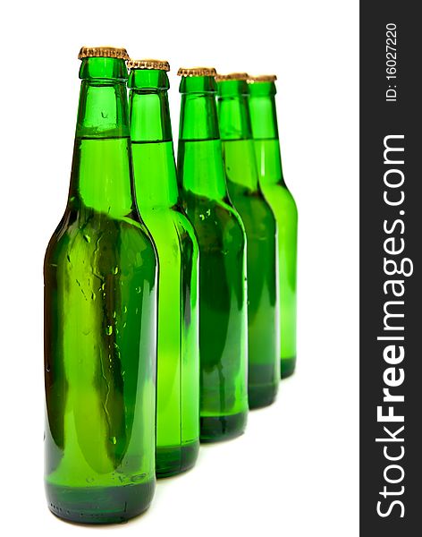 Row from beer bottles. Isolated on white background. Studio shot. Row from beer bottles. Isolated on white background. Studio shot