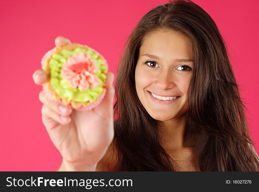 Young woman glad to offer you a delicious cake. Young woman glad to offer you a delicious cake