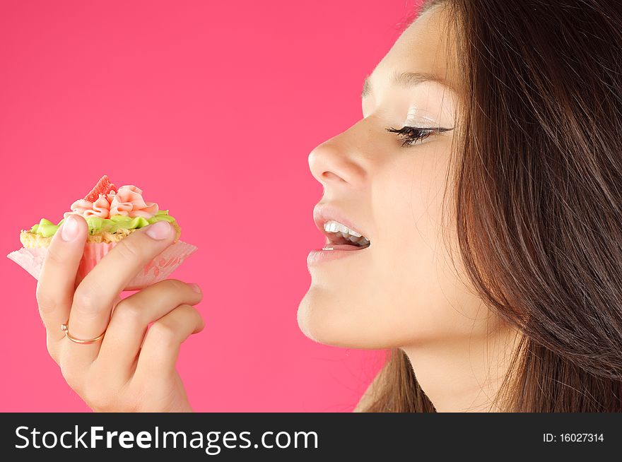 Cute young girl tasting the cream cake. Cute young girl tasting the cream cake