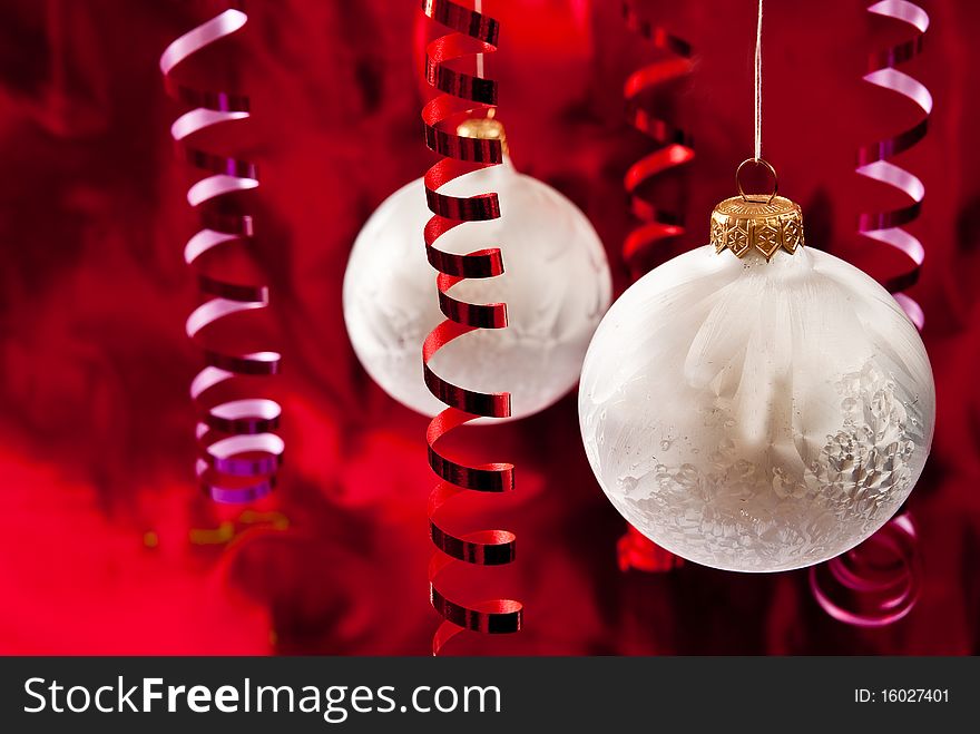 Christmas white baubles and ribbons on red background. Christmas white baubles and ribbons on red background