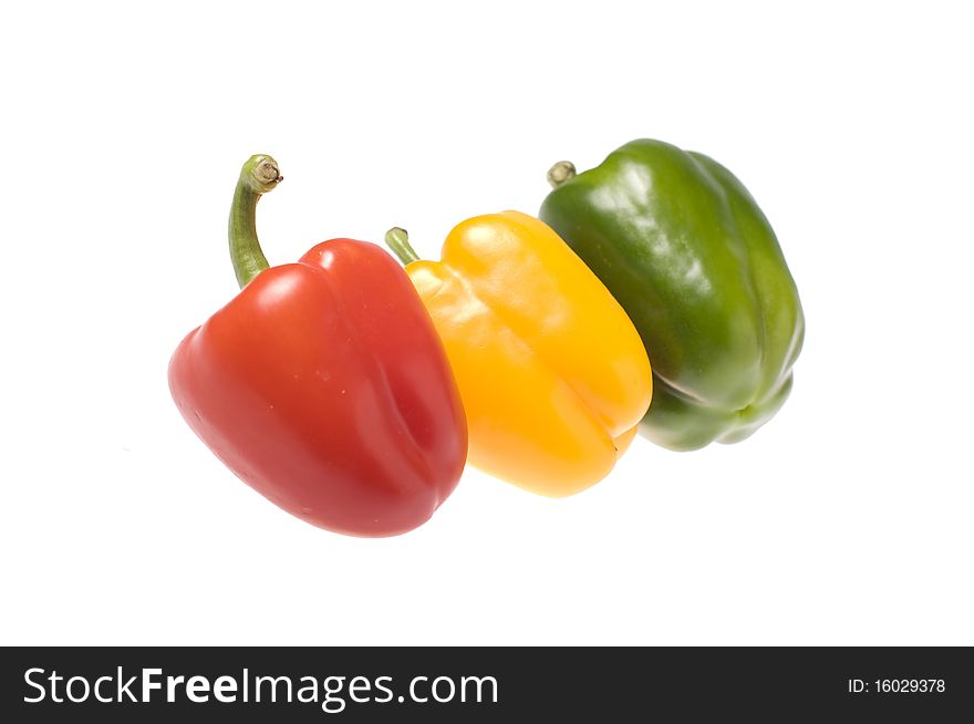 Red green and yellow Sweet Pepper isolated on white