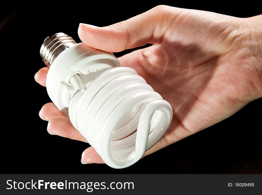 Energy saving light bulb in hand