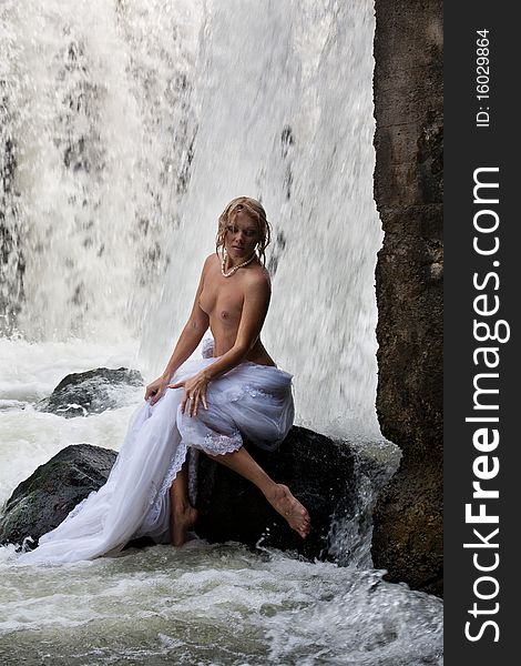 Young Topless Woman In A River