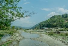 Beautiful Landscape Of Muddy Flooded Road On The Way Up Into Mountains Stock Image Beautiful Landscape Of Muddy Flooded Road On The Way Up Into Mountains Stock Image