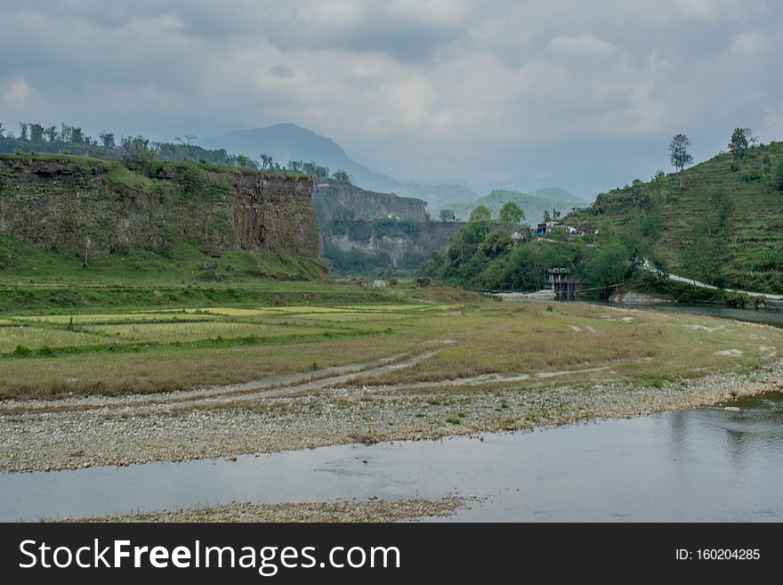 Beautiful landscape view of high hill above river at Himalaya mountains in Nepal