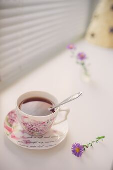 Black Tea In An Elegant Vintage Porcelain Cup And Spoon On The White Windowsill Stock Image