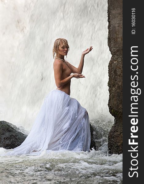 Young Topless Woman In A River