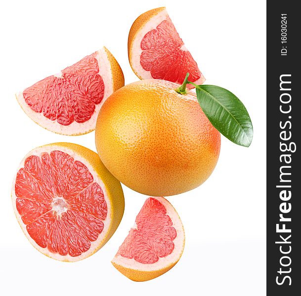 Falling grapefruit and grapefruit slices. Isolated on a white. Falling grapefruit and grapefruit slices. Isolated on a white.