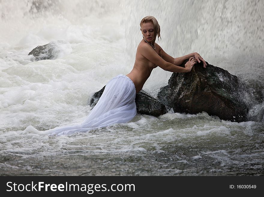 Young Topless Woman In A River