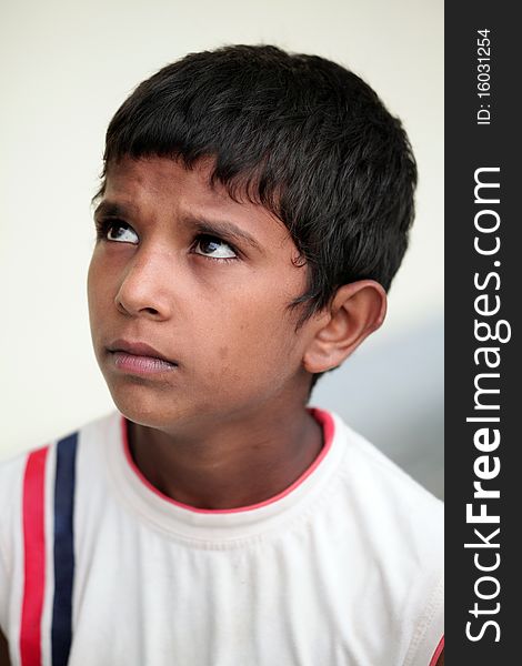 Portrait of a poor indian childlooking upwards for hope. Portrait of a poor indian childlooking upwards for hope.