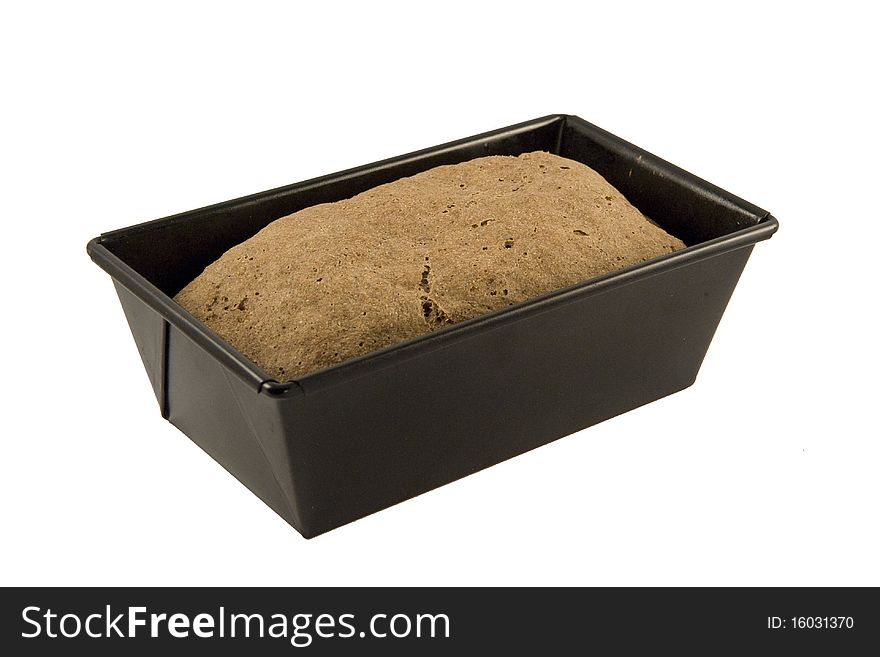 Rye bread in a baking pot isolated on white backgound