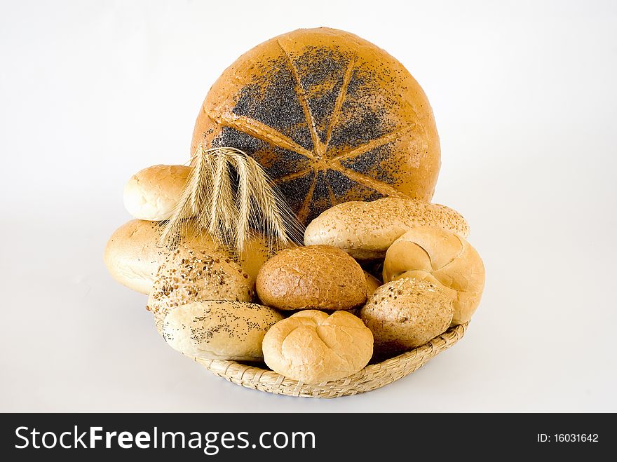 Fresh bread in the basket on the white background