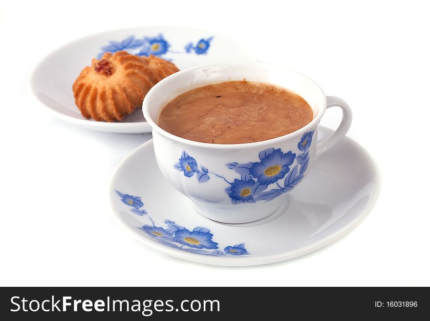 A cup of coffee with foam and biscuits, isolated on white background. A cup of coffee with foam and biscuits, isolated on white background.