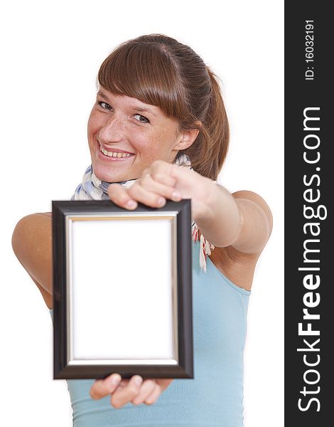 Smiling woman showing empty picture frame in the camera - isolated. Smiling woman showing empty picture frame in the camera - isolated