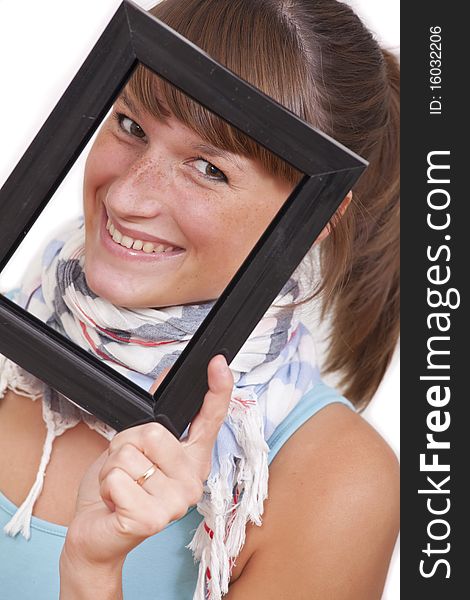 Smiling woman looking through picture frame on white background. Smiling woman looking through picture frame on white background