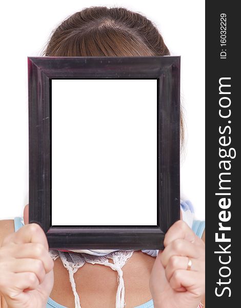 Woman holding empty picture frame for your own face. Woman holding empty picture frame for your own face