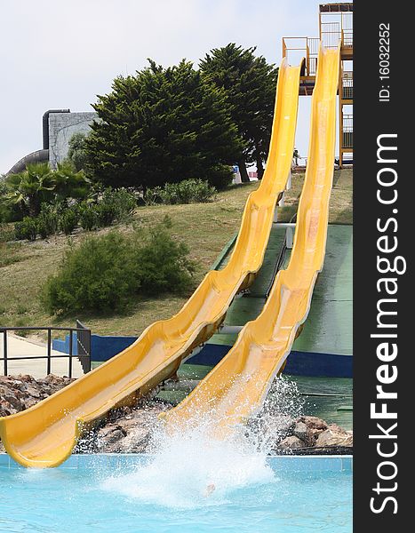 Two yellow slides in the water park. Two yellow slides in the water park