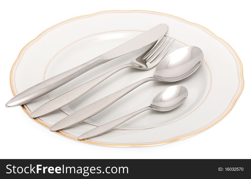 Plate with knife, fork and spoon, elegant cutlery against white background