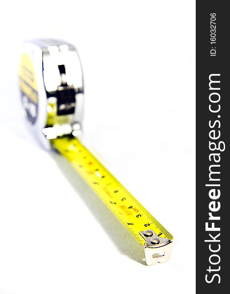 Closeup of silver tape measure on a white background. Closeup of silver tape measure on a white background